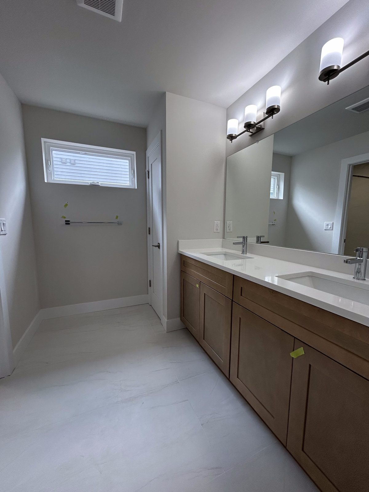 Model 1 first-floor guest suite bathroom with double vanity