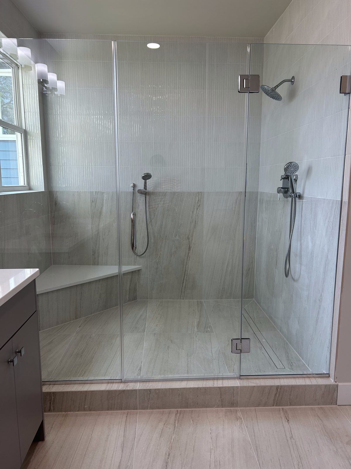 Model 2 primary bathroom glass walk-in shower with bench seat
