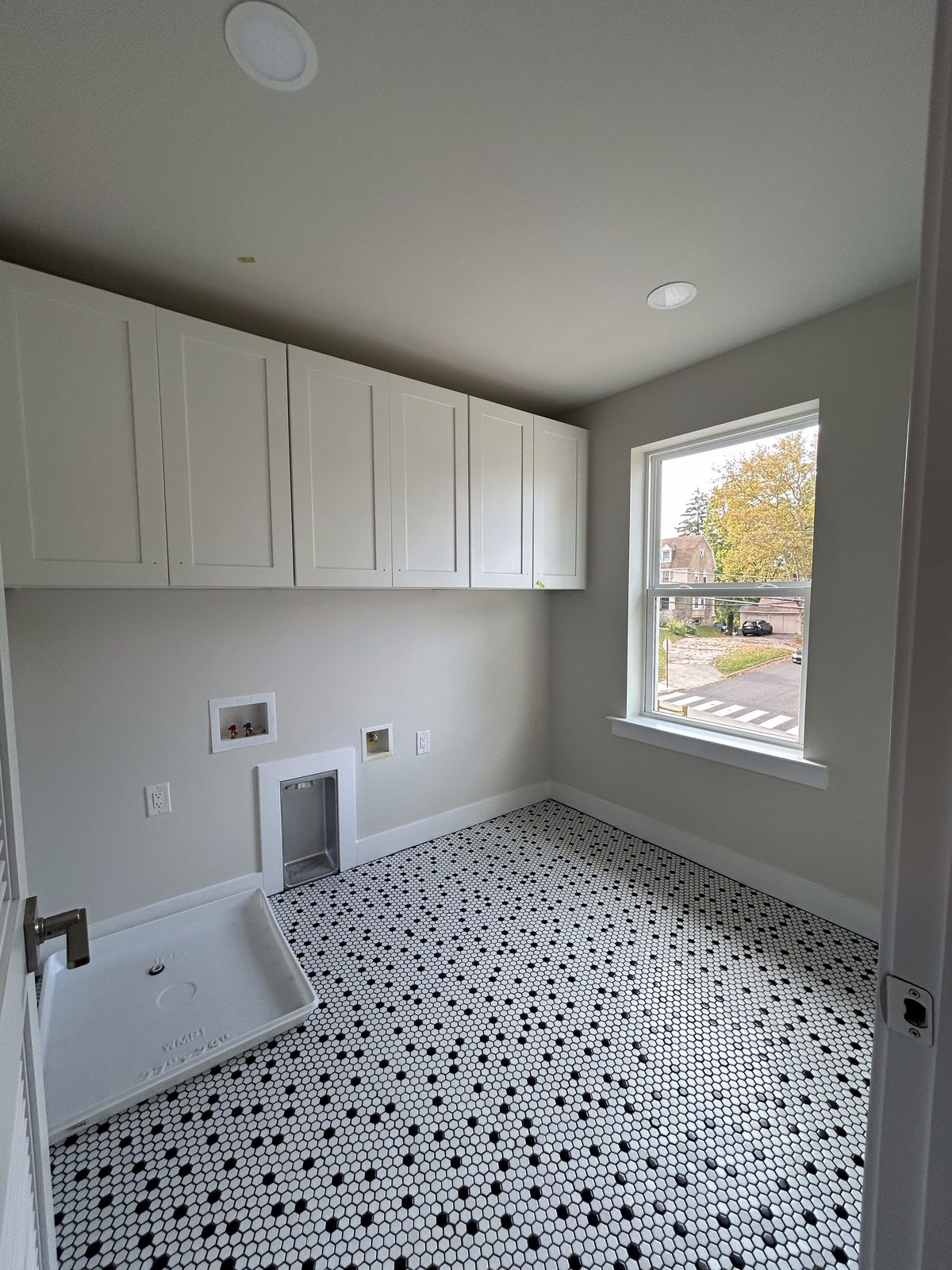 Model 2 second-floor laundry room with patterned tile floor