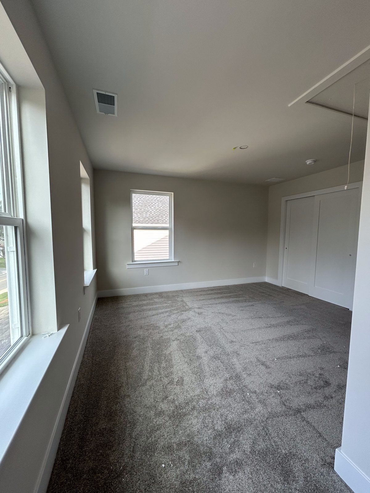 Model 2 upstairs bedroom, unfurnished, with closet