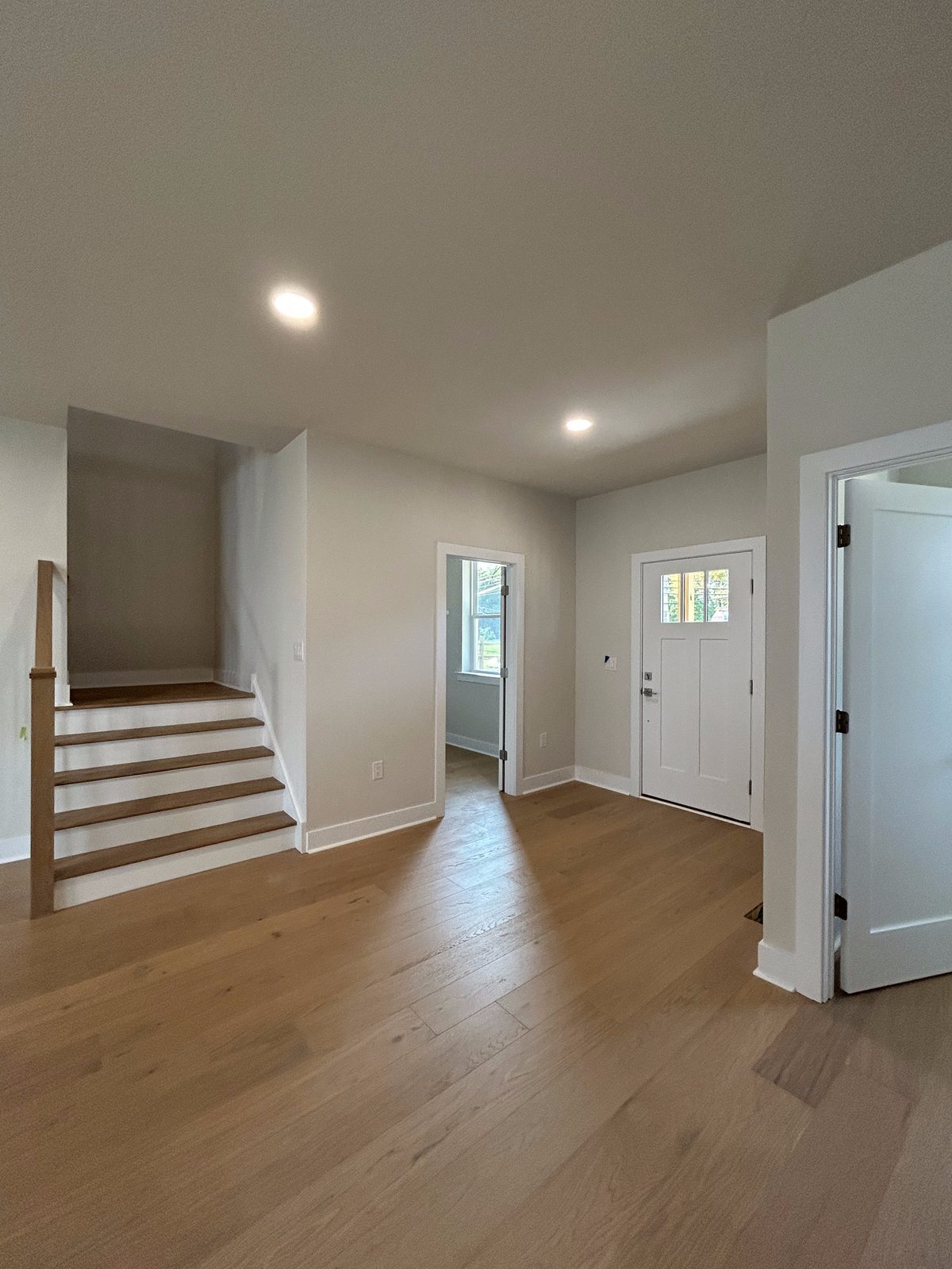 Model 2 entry foyer with staircase and front door