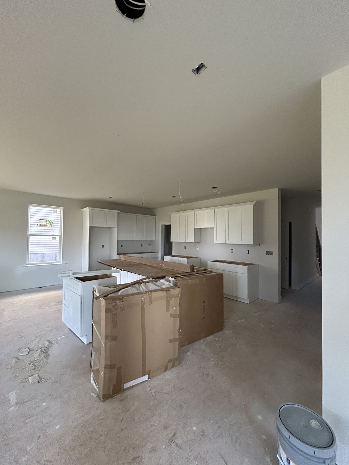 Kitchen cabinets being installed