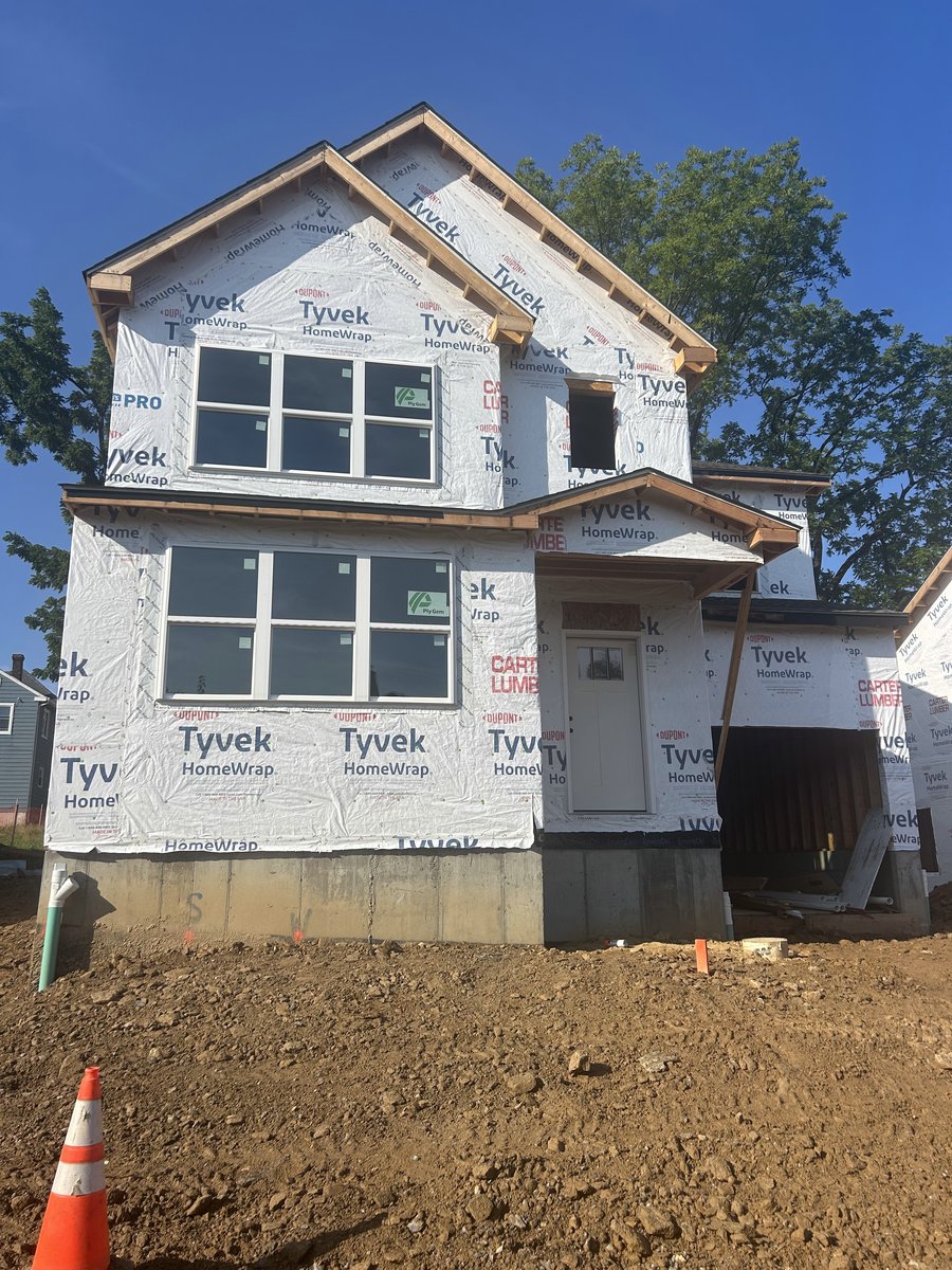 Lot 3 exterior with house wrap and windows installed