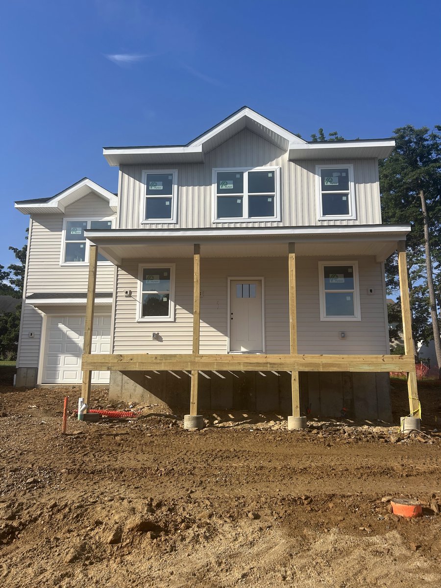 Lot 4 exterior with siding and front porch complete