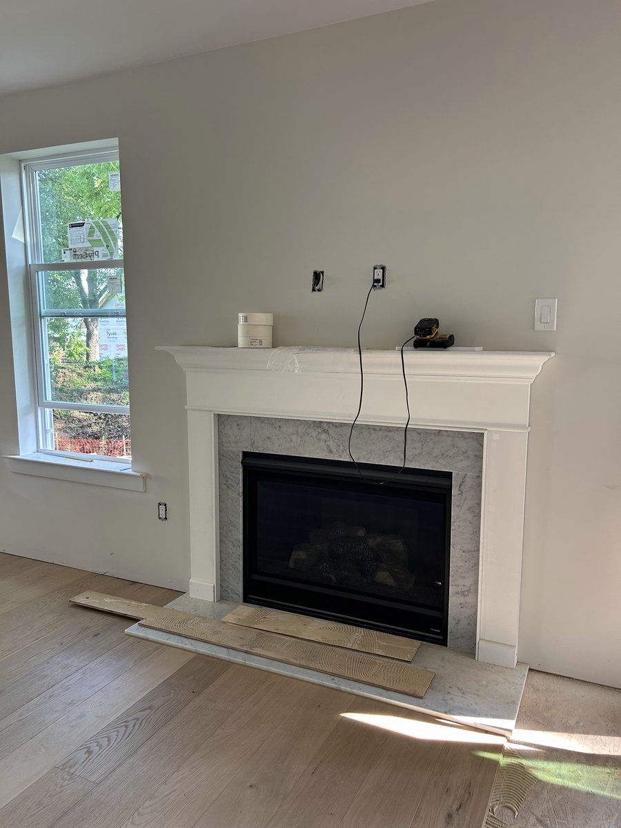 Great room fireplace with marble surround